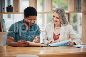 Female leader, manager or boss meeting with an employee, colleague or project leader to discuss a project or report in the boardroom. Business man and woman talking about growth and development