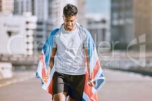 Fitness, training and workout with a sports man in a british flag running a marathon in the city. Health, exercise and wellness with an olympic athlete or runner exercising for cardio and endurance