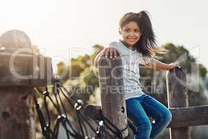 The innocence and bliss of childhood. Cropped portrait of an adorable little girl enjoying some time outdoors.