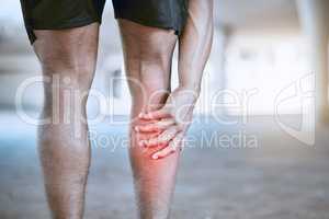 Sports man hand on a leg injury while training, exercise or workout. Red graphic to identify muscle ache or pain in the body after running accident outdoor. Athlete hurt after cardio fitness routine