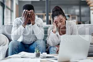 Stress, anxiety and worry with a young couple struggling with finance, debt and the home budget in the living room. Man and woman feeling negative and depressed with inflation and loan repayment