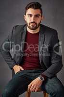 Style is the perfection of a point of view. Studio portrait of a handsome young man posing against a dark background.